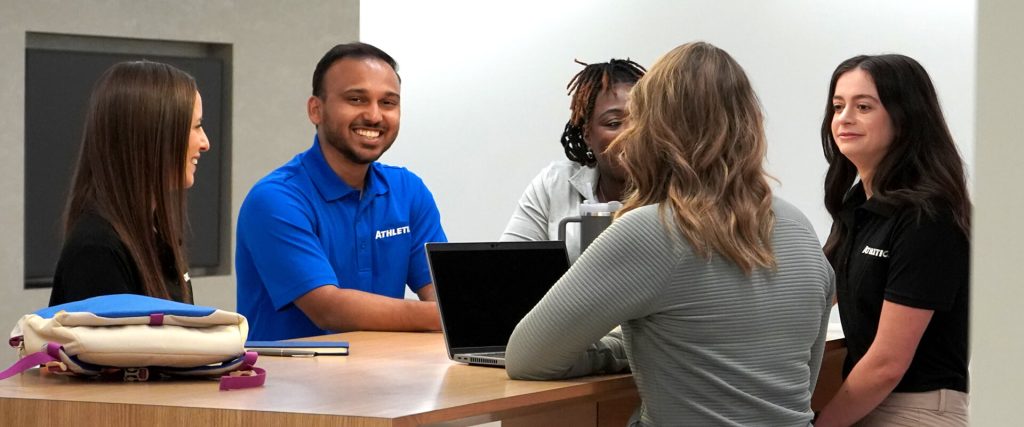 Group of people sitting at a desk
